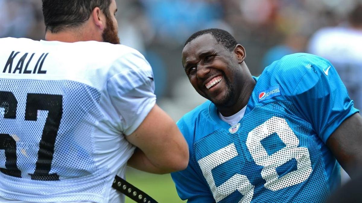 Carolina Panthers center Ryan Kalil (67) and linebacker Thomas Davis (58) talk following a practice in 2014. The two players have both said that 2018 will be their final season before retirement.