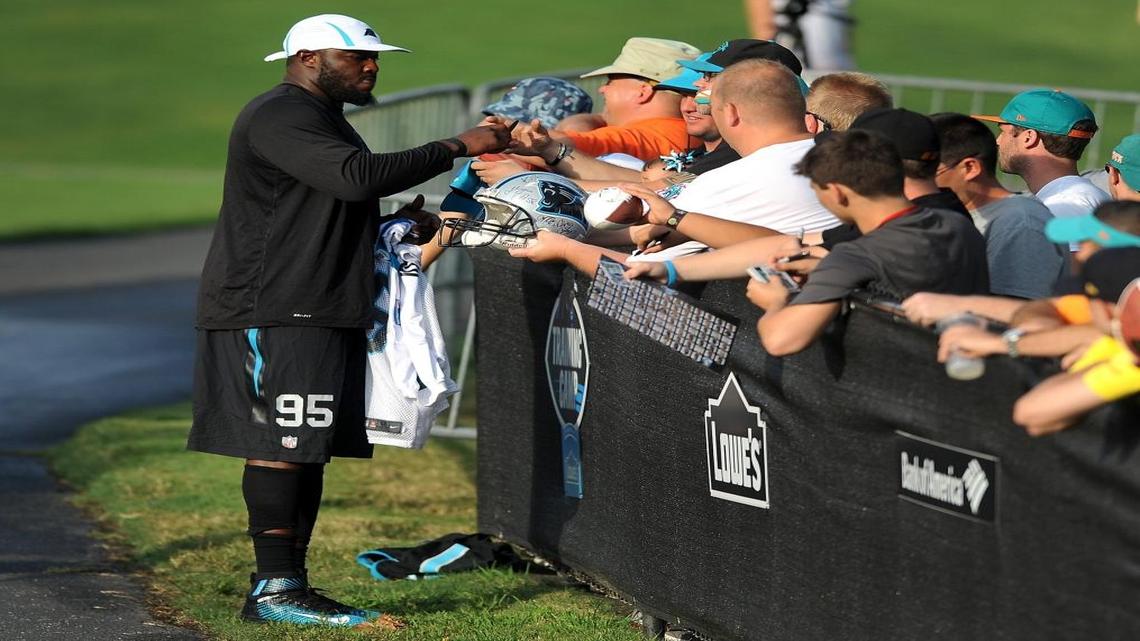
Panthers defensive end Charles Johnson – shown signing autographs at training camp – did not play a down in preseason because of injury. He plans to play Sunday at Jacksonville, but how much does he have left in that body? 

