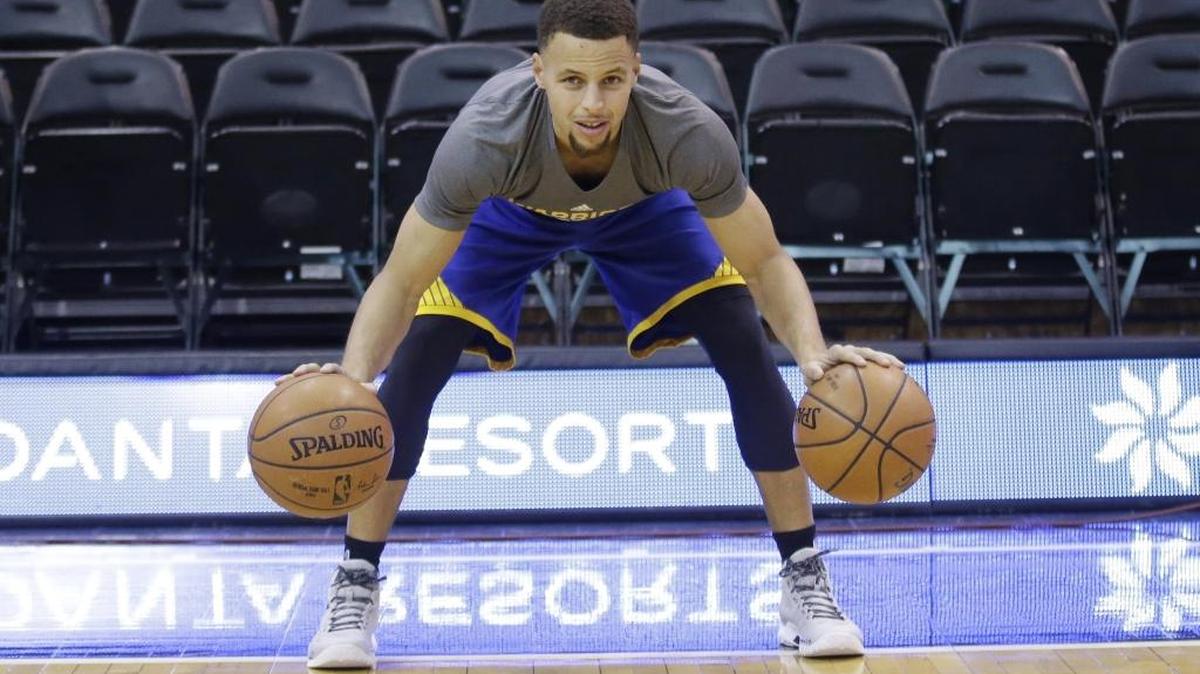 Stephen Curry warms before the start of the Golden State Warriors’ game against the Utah Jazz on Monday. Golden State takes on the host Charlotte Hornets on Wednesday.