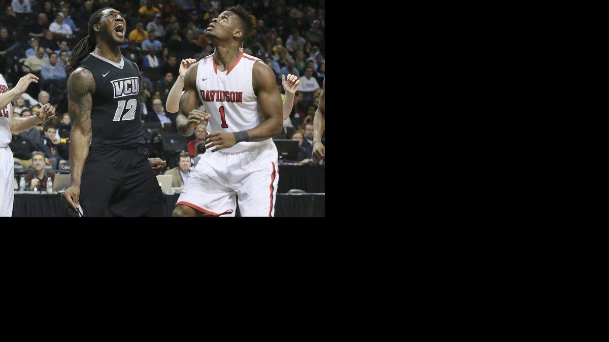 
Virginia Commonwealth’s Mo Alie-Cox (12) reacts after scoring and drawing a foul from Davidson’s Nathan Ekwu on Saturday. 
