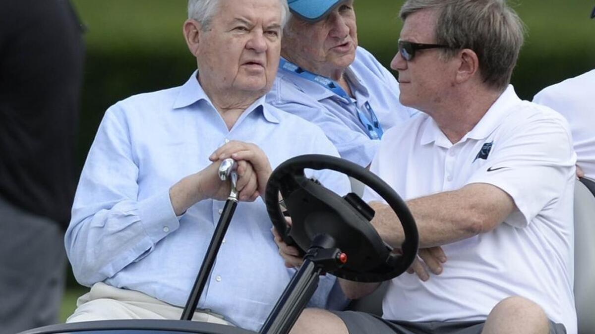 Carolina Panthers owner Jerry Richardson, left, announced he was selling the team in December. Interim general manager Marty Hurney (right) has applied for the permanent job, but has been temporarily placed on paid administrative leave by the Panthers.