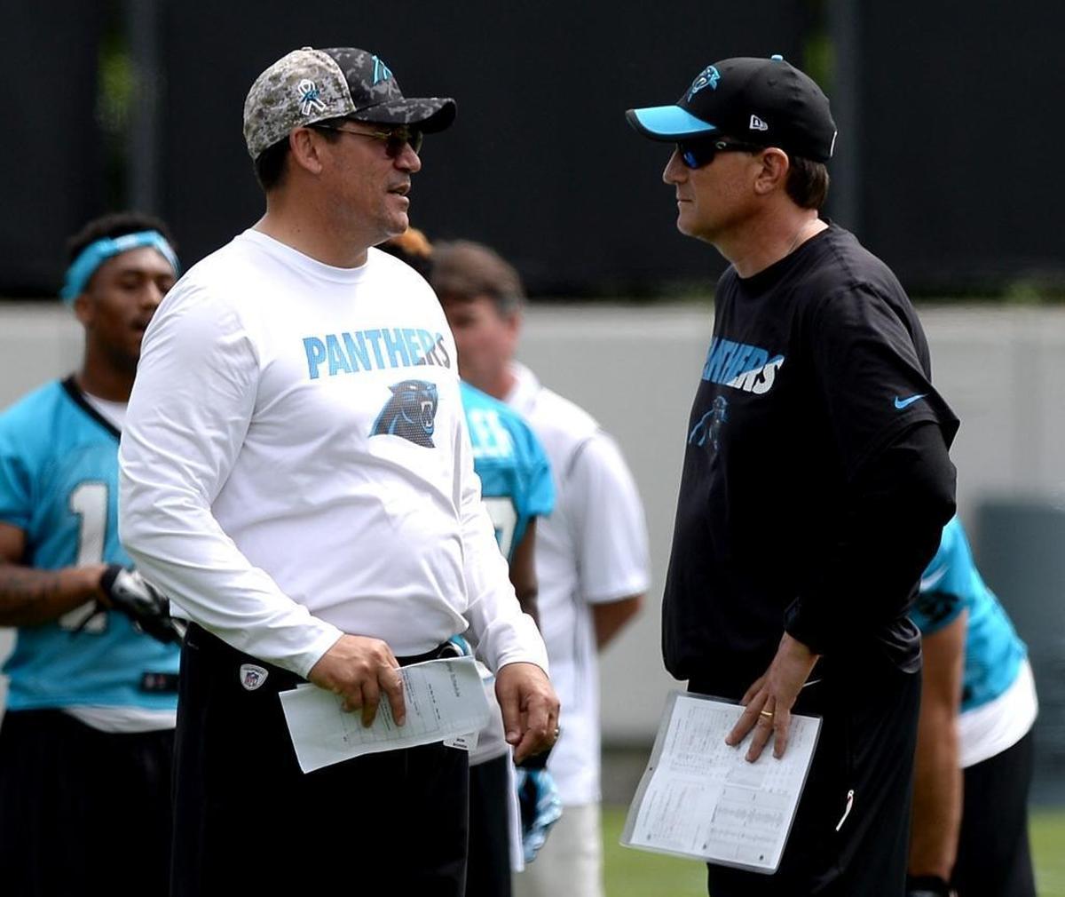 Carolina Panthers head coach Ron Rivera, left, said he fired offensive coordinator Mike Shula on Tuesday morning after re-evaluating his coaching staff following a season that ended Sunday with Carolina’s 31-26 playoff loss to New Orleans.