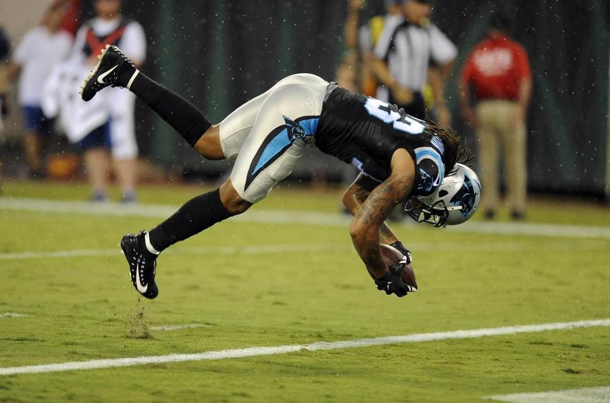 Carolina Panthers wide receiver Kelvin Benjamin (13) somersaults into the end zone for a touchdown against Jacksonville Thursday night. Benjamin caught a nine-yard slant pass from Cam Newton for the TD.
