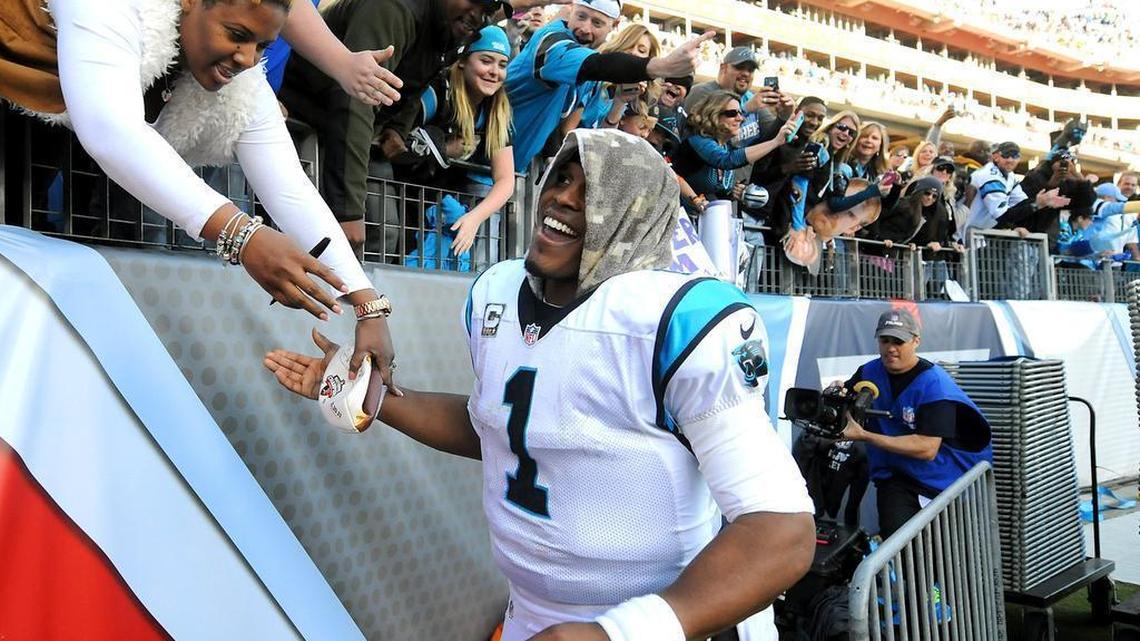 Panthers quarterback Cam Newton reaches out and connects with fans on postgame victory laps and after touchdowns.
