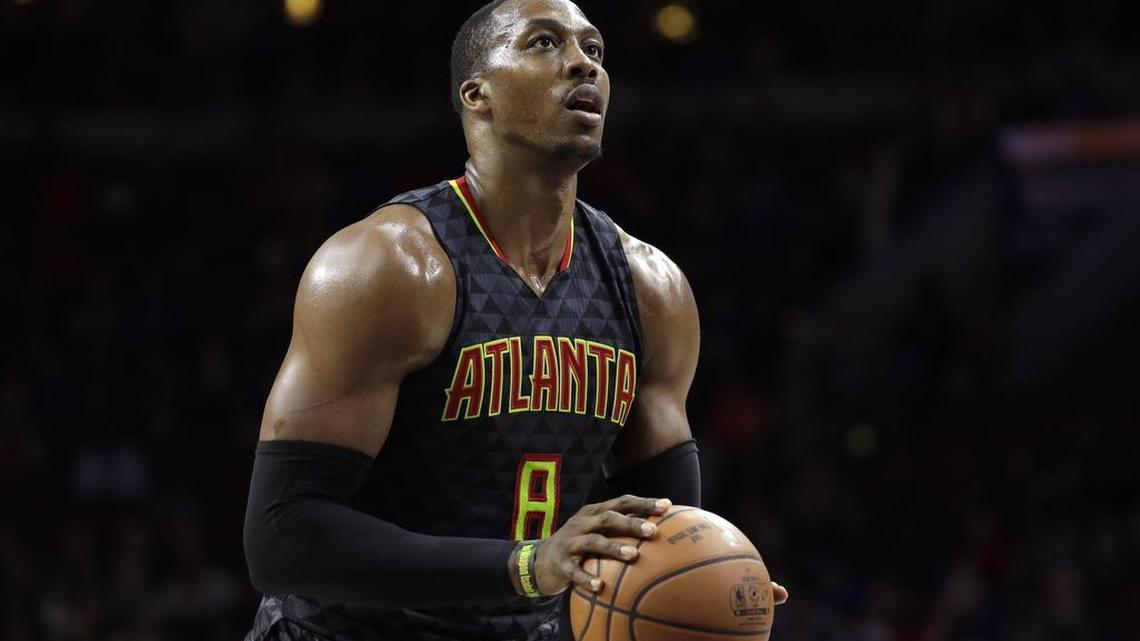 Dwight Howard, an eight-time NBA all-star, was traded Tuesday night from the Atlanta Hawks to the Charlotte Hornets for Marco Belinelli and Miles Plumlee.
