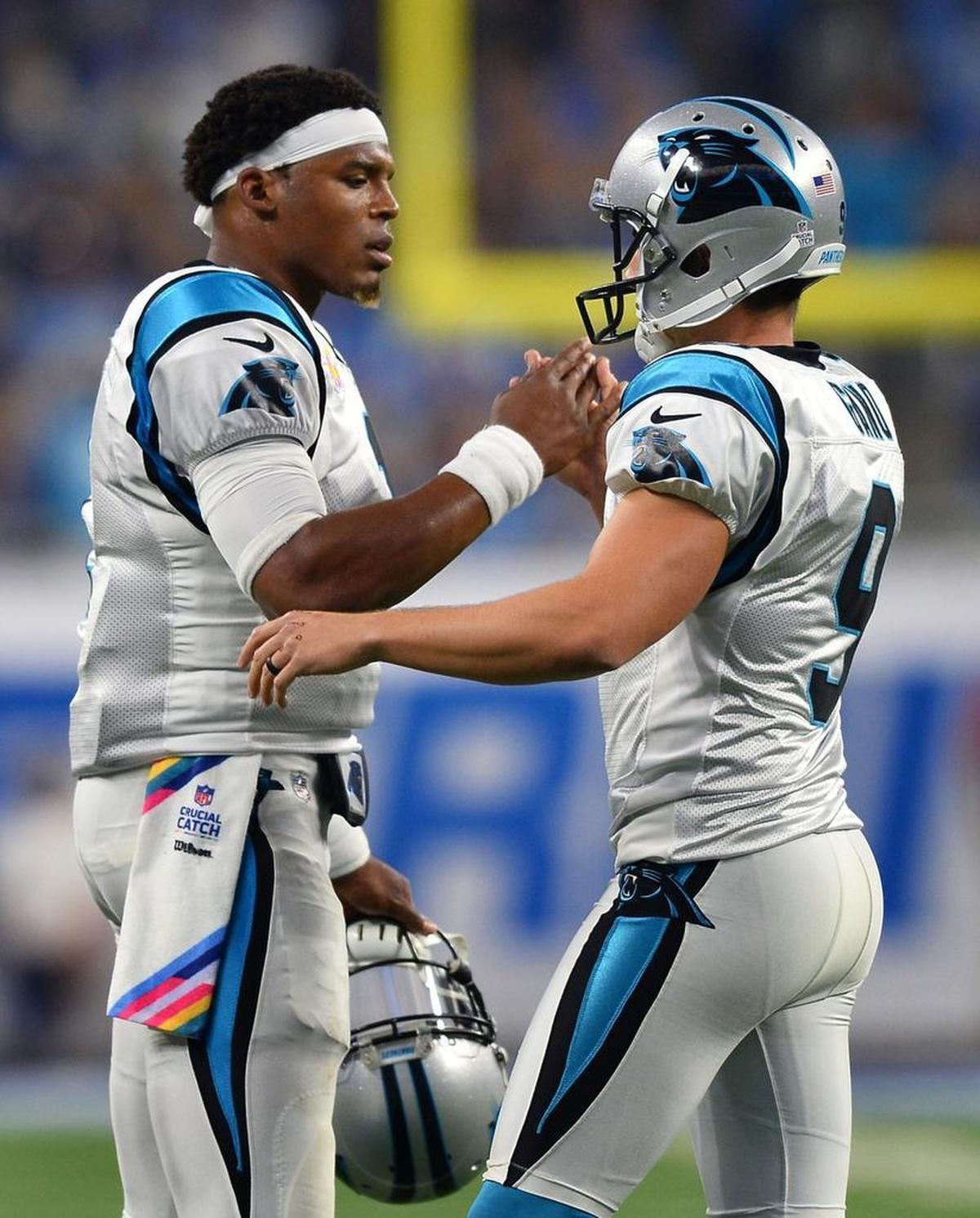 Carolina quarterback Cam Newton, left, congratulates kicker Graham Gano on a made field goal against Detroit Sunday.
