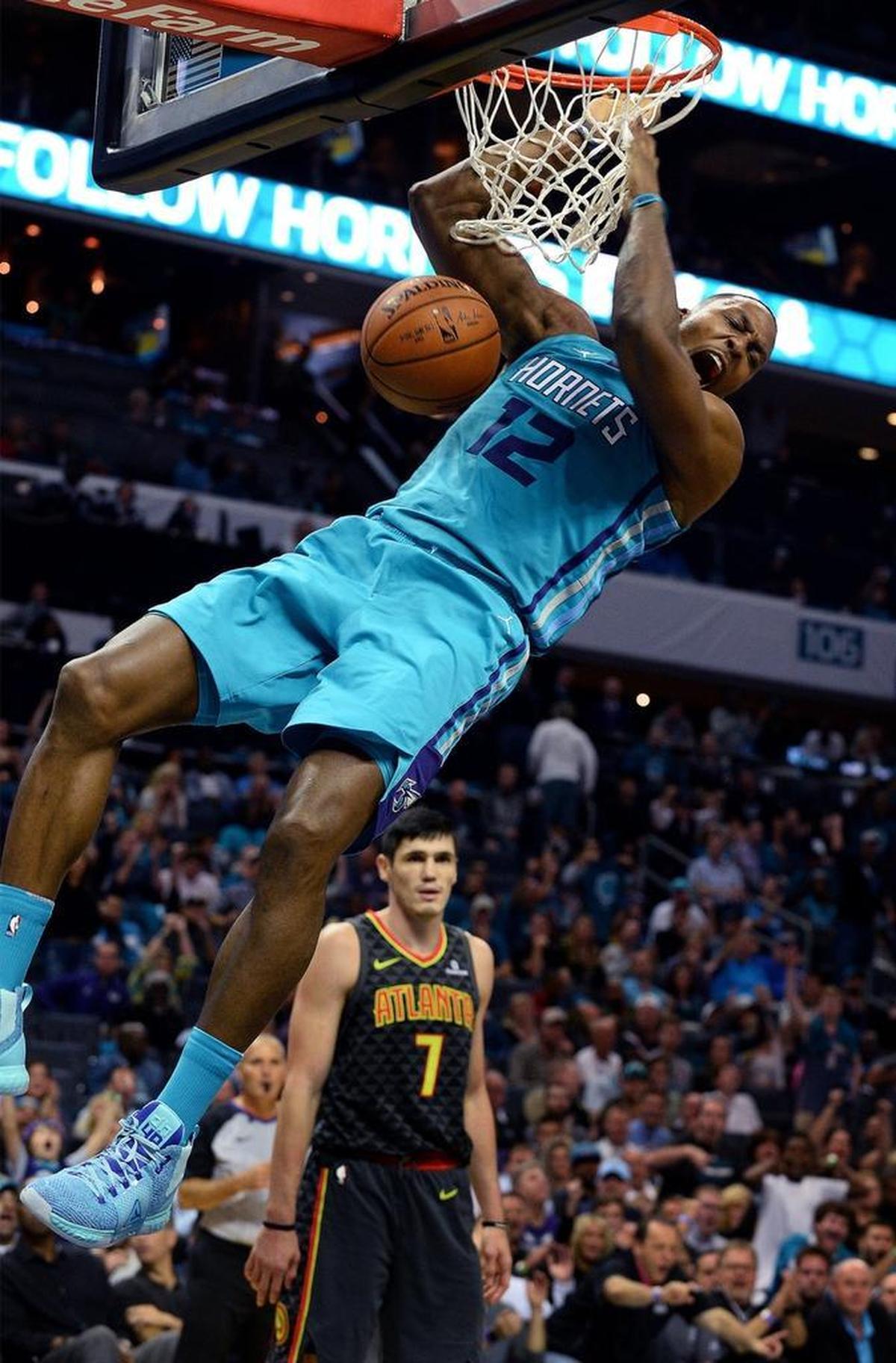 Charlotte Hornets center Dwight Howard throws down a two-handed dunk against the Atlanta Hawks. Howard was instrumental in Charlotte’s 24-0 run that broke the game open in the third quarter and led to a 109-91 Charlotte win.