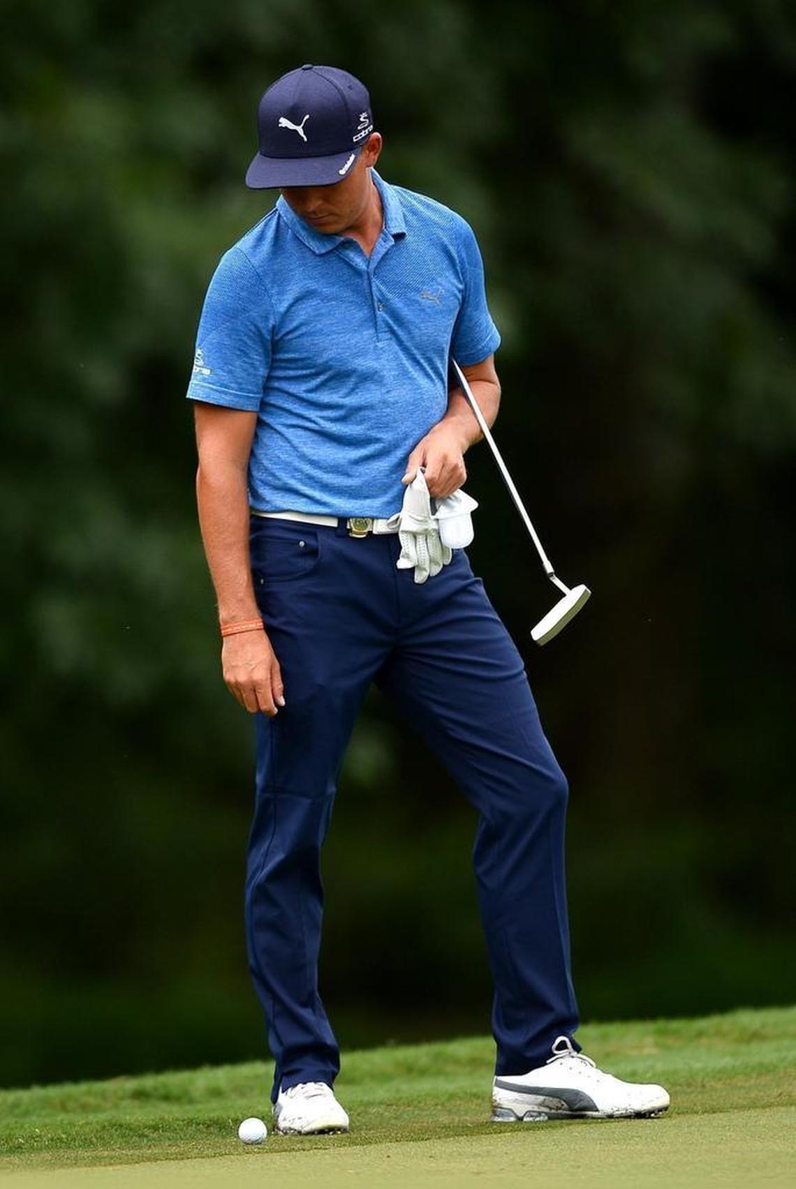 Rickie Fowler’s first two rounds have included some mistakes, including this chip shot on the 13th hole that rolled right back to him.