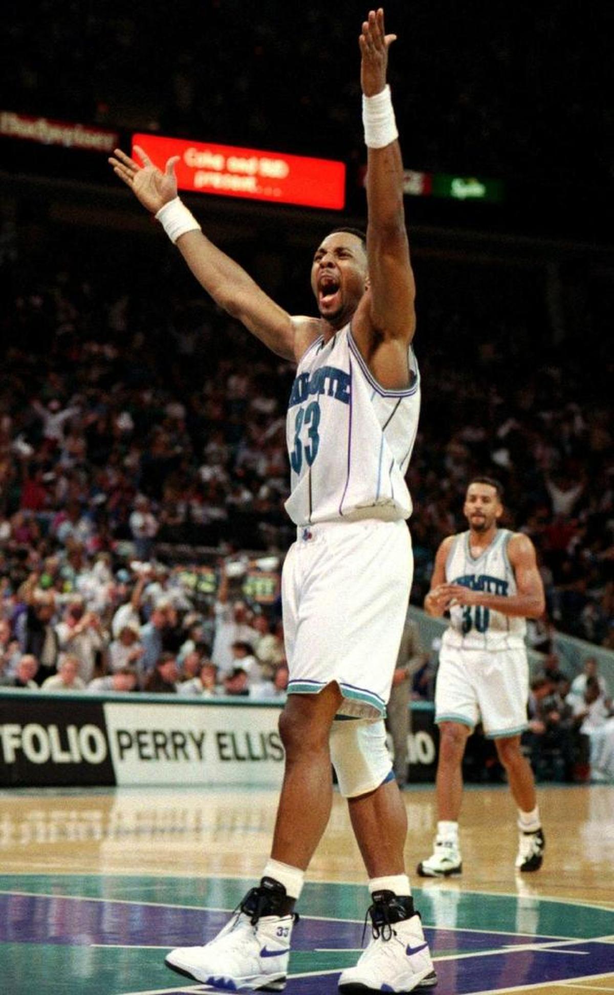 Dell Curry (in background) says that the Charlotte Hornets haven’t had a player with the inside skills of Dwight Howard since they employed Alonzo Mourning (foreground) in the 1990s.