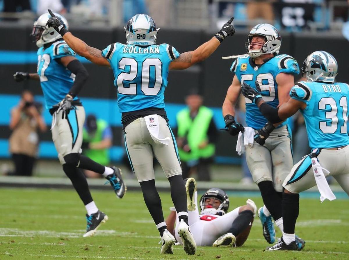 Atlanta Falcons wide receiver Taylor Gabriel lays on the ground as Kurt Coleman (20) and Luke Kuechly (59) celebrate following an incompletion on Atlanta’s final offensive play of the game.