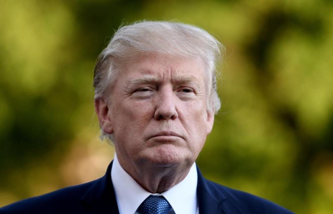 President Donald Trump answers questions from the media after stepping off of Marine One on the South Lawn of the White House in Washington, D.C., on Sunday.