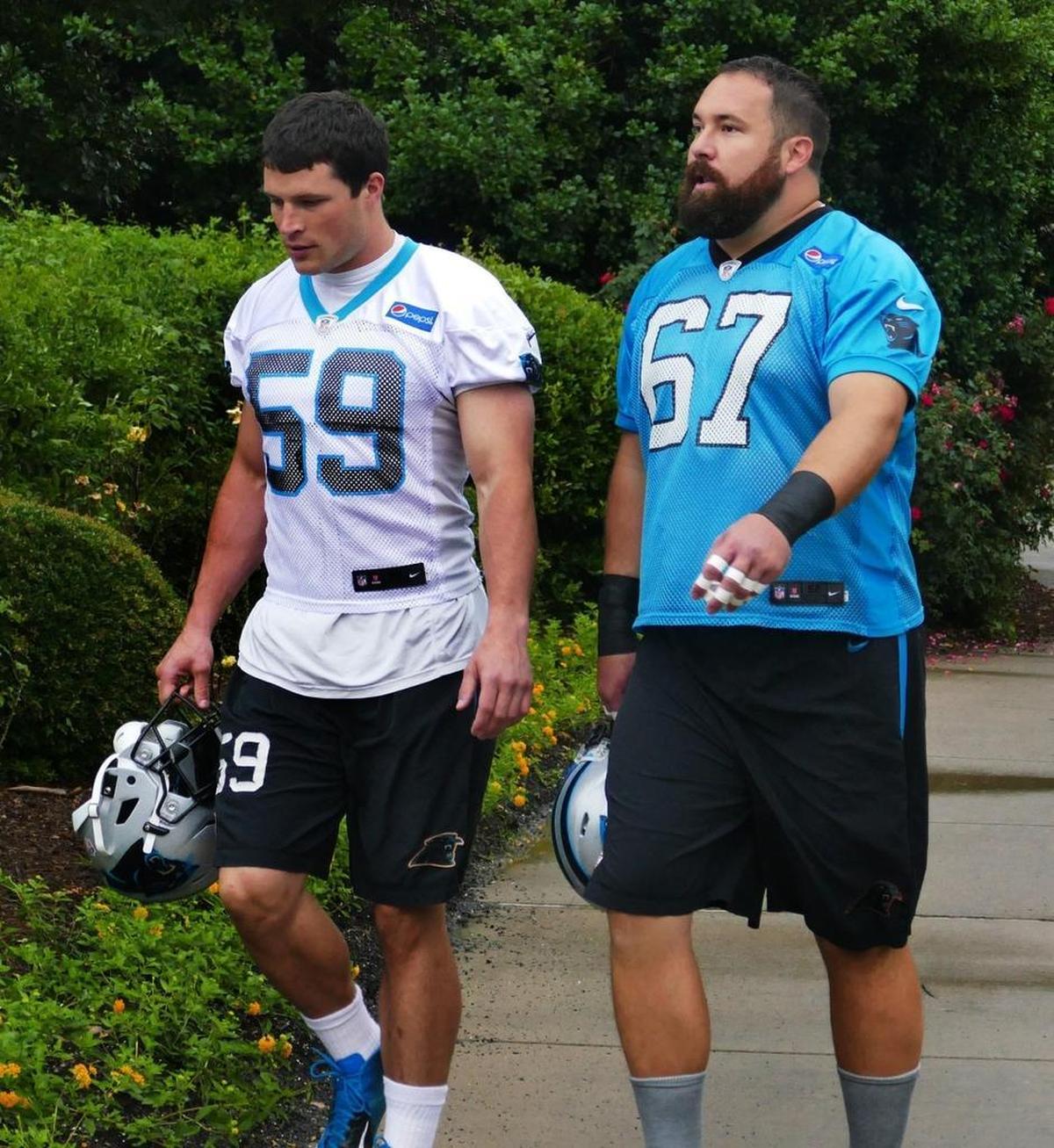 Carolina Panthers linebacker Luke Kuechly (left) found his way back into the P-I-G tournament run by center Ryan Kalil (67) when his toy horse won the “Spartanburg Derby.” Kuechly celebrated as if he had just made a game-winning interception.