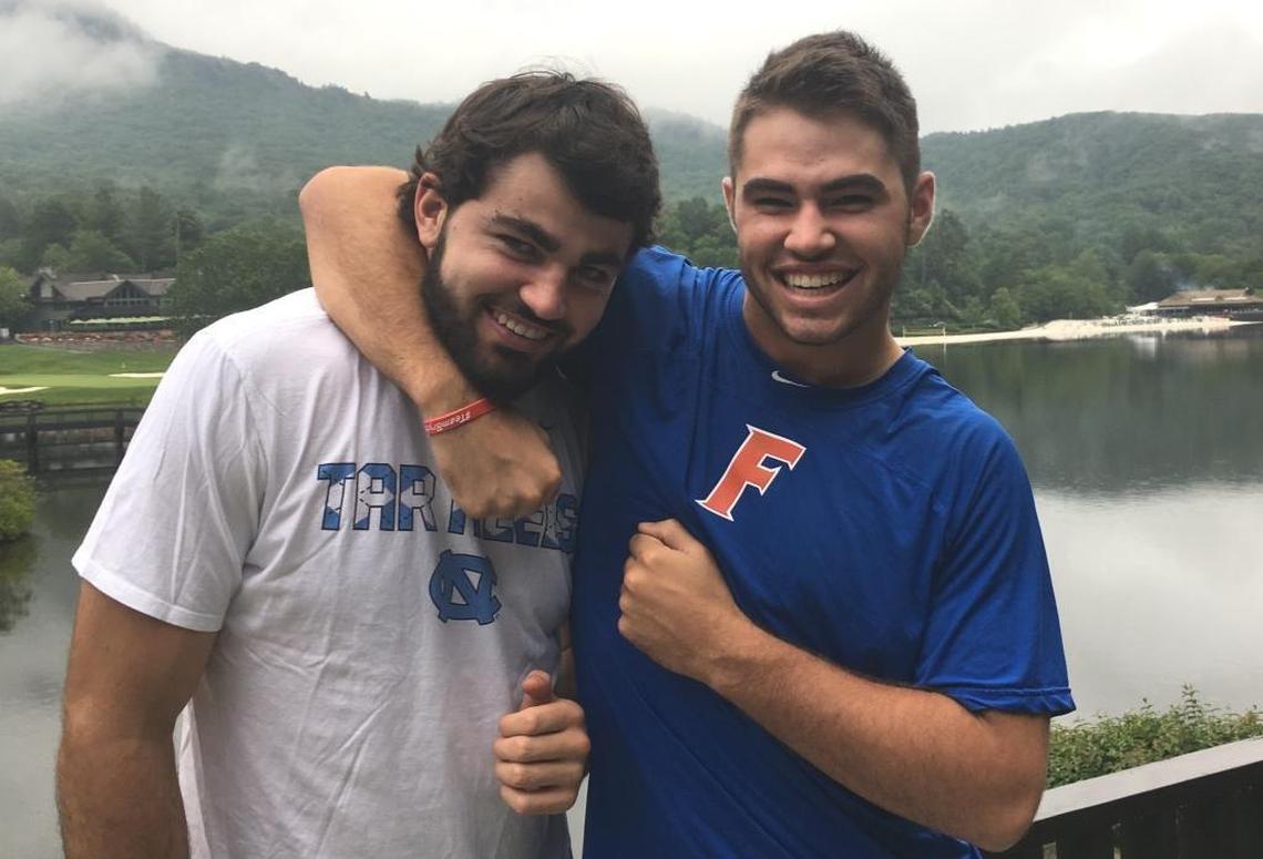 Cole Maye (right) puts big brother Luke in a headlock in the summer of 2017 in the North Carolina mountains. Both brothers won national championships in 2017.