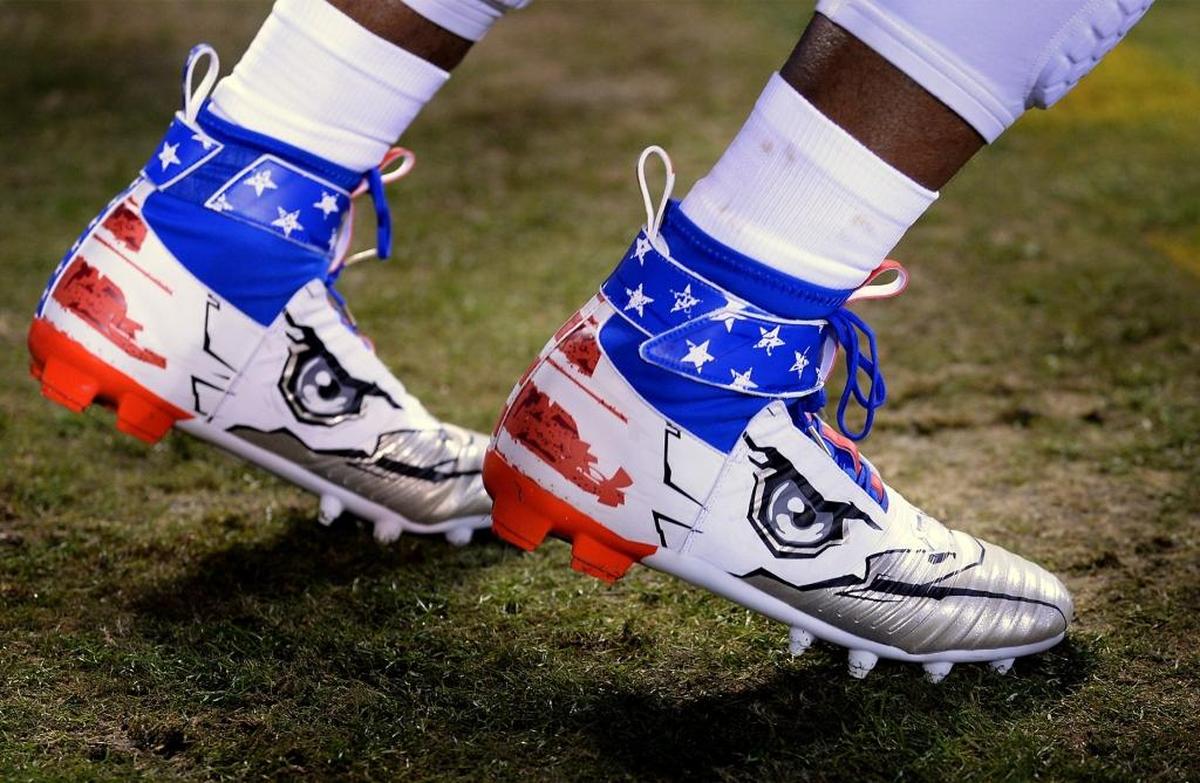 Carolina Panthers quarterback Cam Newton’s pregame cleats fit with Monday night’s “Salute to Service” theme. Newton ended up with four touchdown passes, no turnovers and 95 yards rushing.