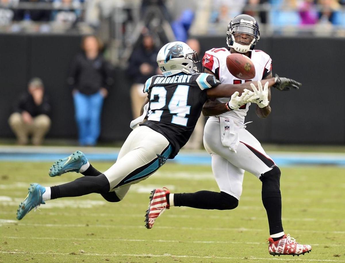 Carolina Panthers cornerback James Bradberry (24) breaks up a pass intended for Atlanta Falcons wide receiver Julio Jones last December. In the team’s first matchup in 2016, Jones torched the Panthers for 300 receiving yards.