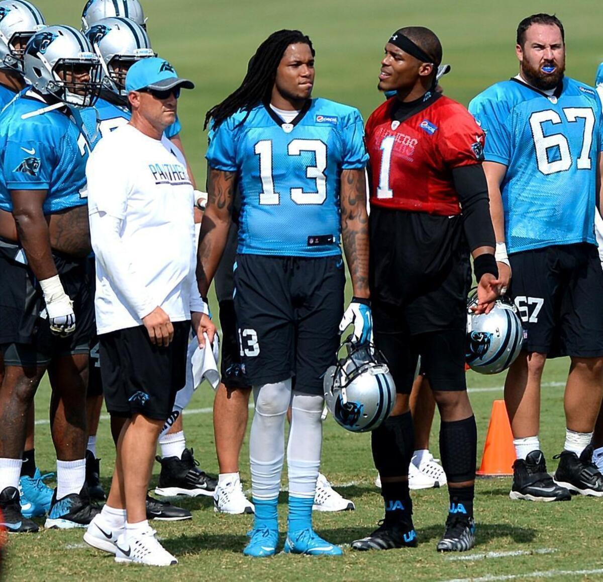 Panthers offensive coordinator Mike Shula (in cap), wide receiver Kelvin Benjamin (13) and quarterback Cam Newton (1) will all have their own personal battles this season as Carolina tries to get back to what was the NFL’s No. 1 offense in 2015.