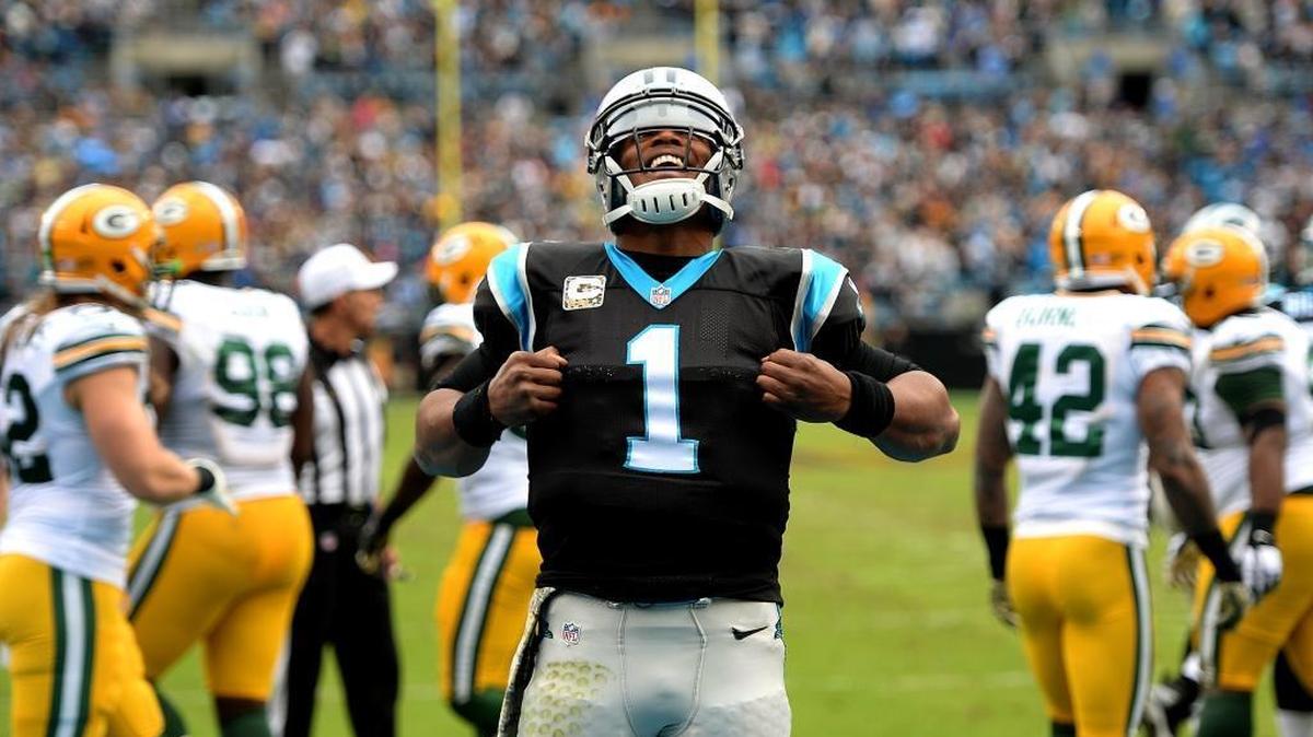 Carolina Panthers quarterback Cam Newton celebrates his touchdown against the Green Bay Packers on Sunday. He accounted for four touchdowns as the Panthers (8-0) took an important step toward securing home-field advantage throughout the NFC playoffs with the win.