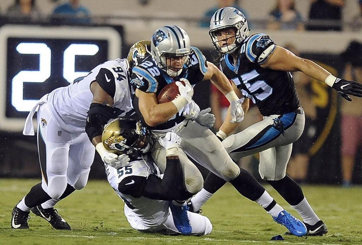 Carolina Panthers running back Christian McCaffrey (22) is the Panthers’ No. 1 punt returner due to his elusiveness, but he took a couple of hard hits performing the duty Thursday night in Jacksonville.