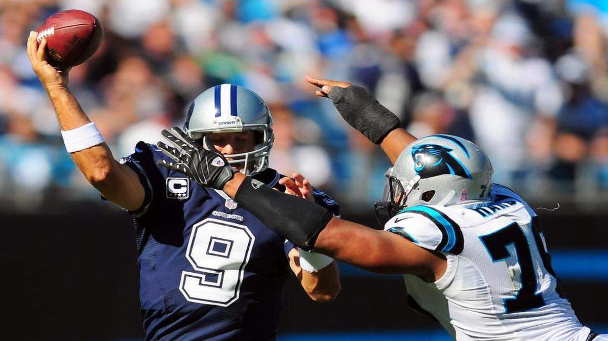 
Greg Hardy, shown in 2012 trying to sack Dallas quarterback Tony Romo, is now a teammate of Romo’s on the Dallas Cowboys. But Hardy was handed a 10-game suspension by the NFL this week. The suspension will be appealed -- Hardy’s Cowboys face Carolina this season on Thanksgiving Day in Texas.
