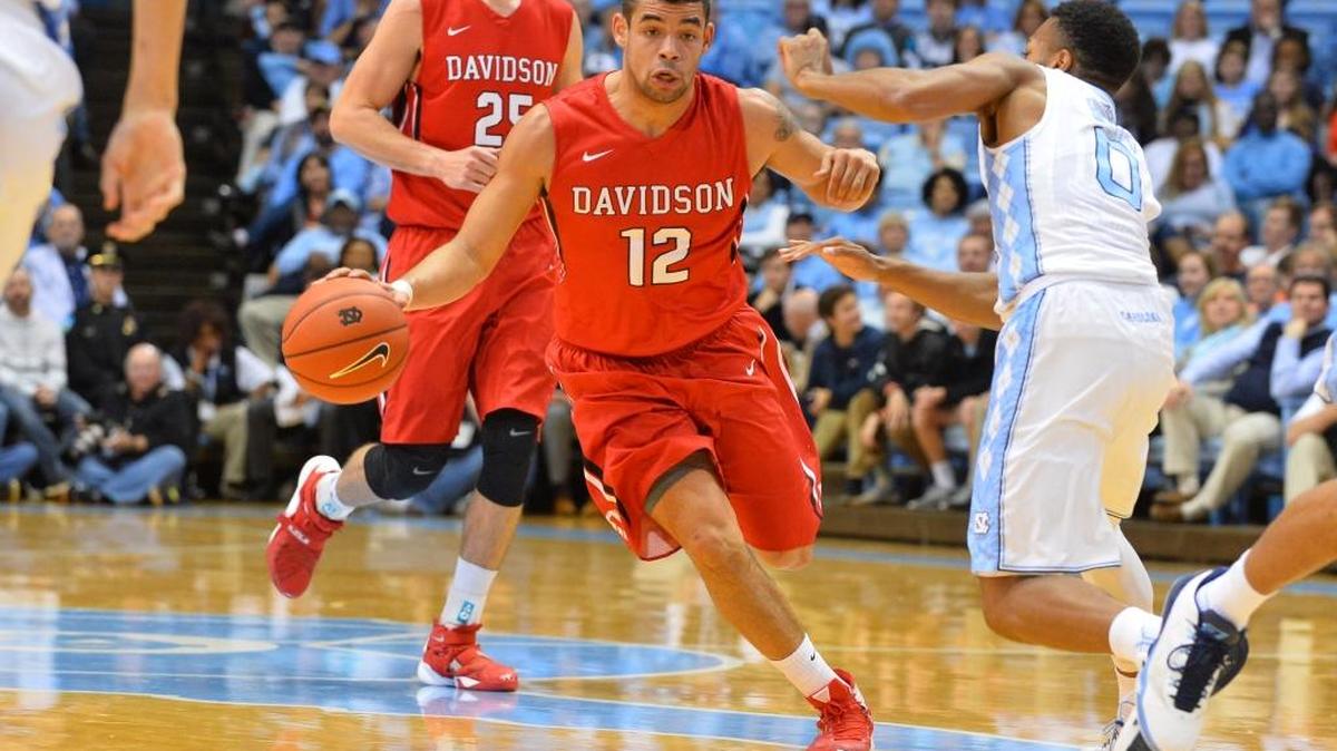Davidson point guard Jack Gibbs (12), shown last season against North Carolina’s Nate Britt, is seventh in the country in scoring at 23.3 points. Gibbs and the Wildcats will return to Chapel Hill Wednesday night hoping to avenge last season’s 98-65 loss to the Tar Heels.