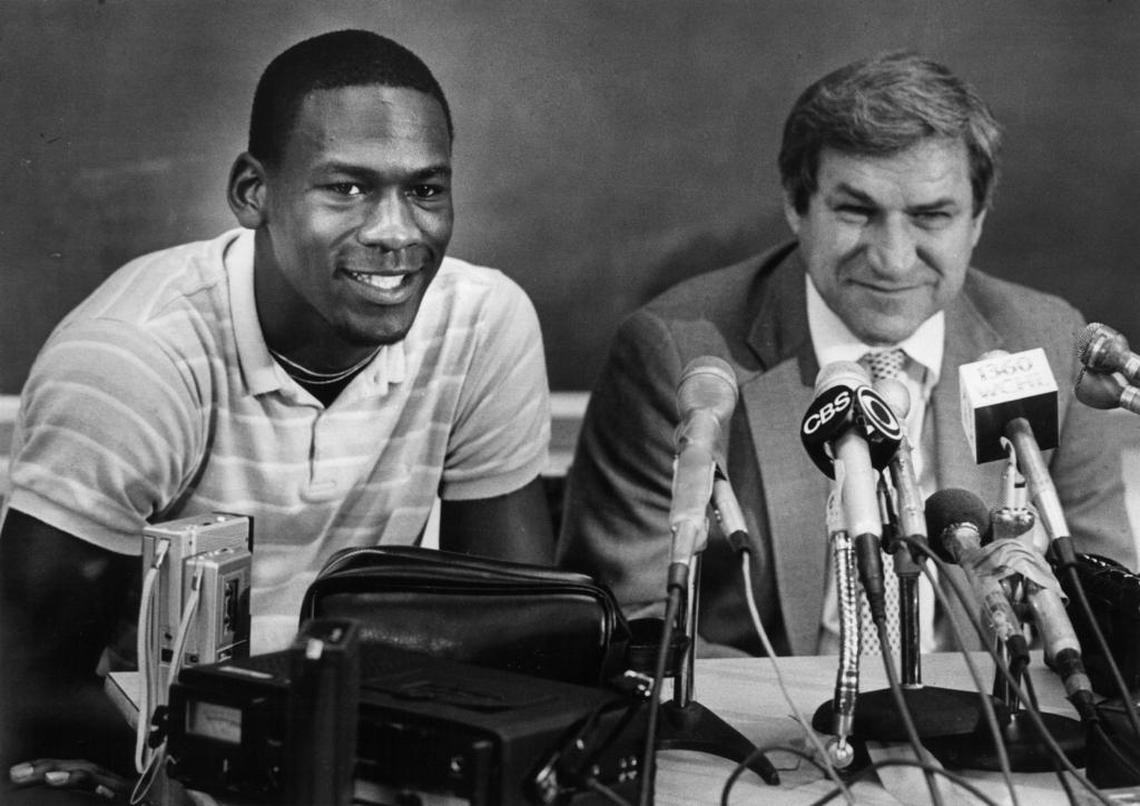 When Michael Jordan (left) was a freshman, North Carolina basketball coach Dean Smith told Woody Durham that “the youngster from Wilmington is going to be able to help us.”
