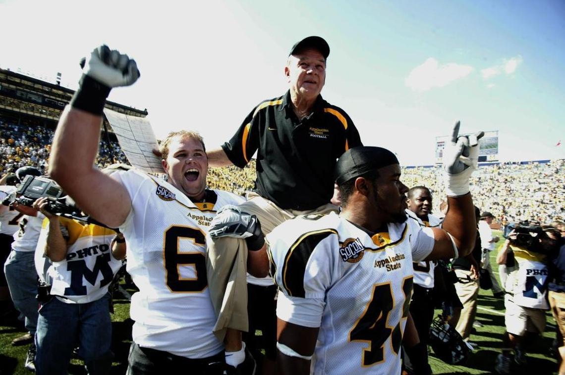 Appalachian State head coach Jerry Moore is lifted on the shoulders of his players moments after a 34-32 upset win over Michigan at Michigan Stadium on Sept. 1, 2007.