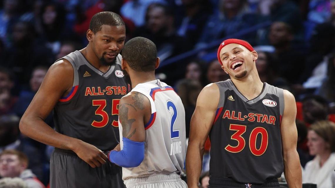 Western Conference guard Stephen Curry (30) laughs with forward Kevin Durant (35) and Eastern Conference guard Kyrie Irving (2) at the NBA All-Star Game in New Orleans this year. In February 2019, the All-Star Game will be played in Charlotte, Curry’s hometown.