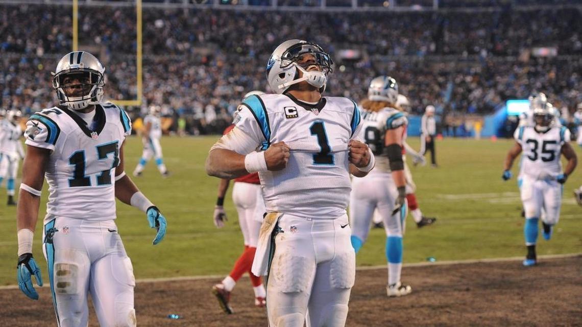 Carolina Panthers quarterback Cam Newton mimics ripping off his shirt like Superman after his third-quarter touchdown Sunday night against the Arizona Cardinals at Bank of America Stadium. The Panthers won 49-15 to advance to Super Bowl 50.