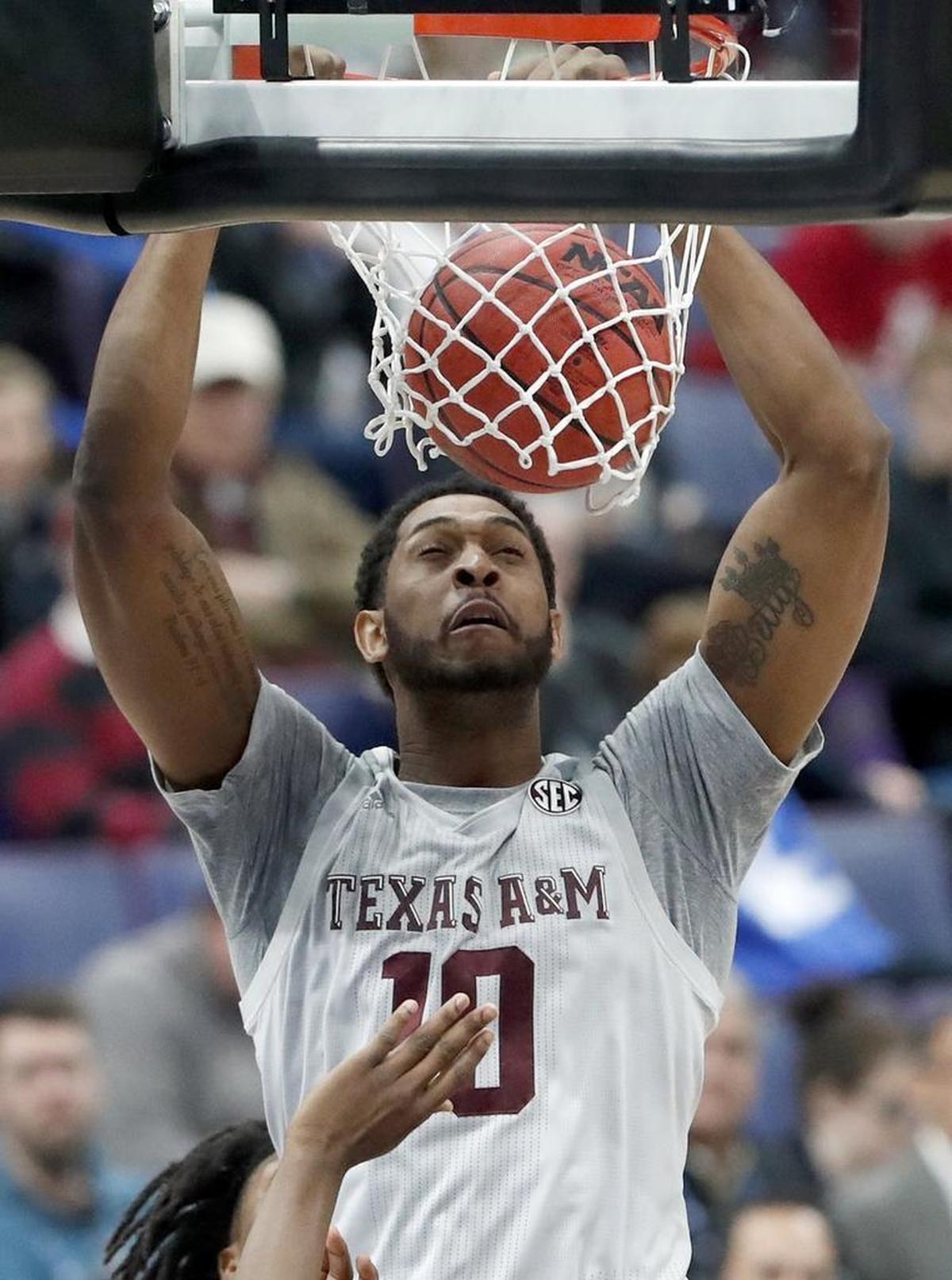 Texas A&M's Tonny Trocha-Morelos dunks against Alabama at the SEC tournament. The Aggies will face Providence Friday in Charlotte in the NCAA tournament.