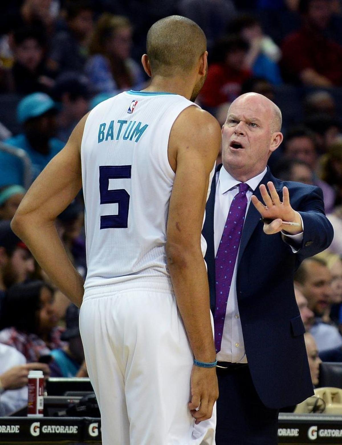 Charlotte Hornets head coach Steve Clifford, right, talks with guard Nicolas Batum. Clifford returns to coaching next week after missing more than a month of the season due to severe and chronic headaches.