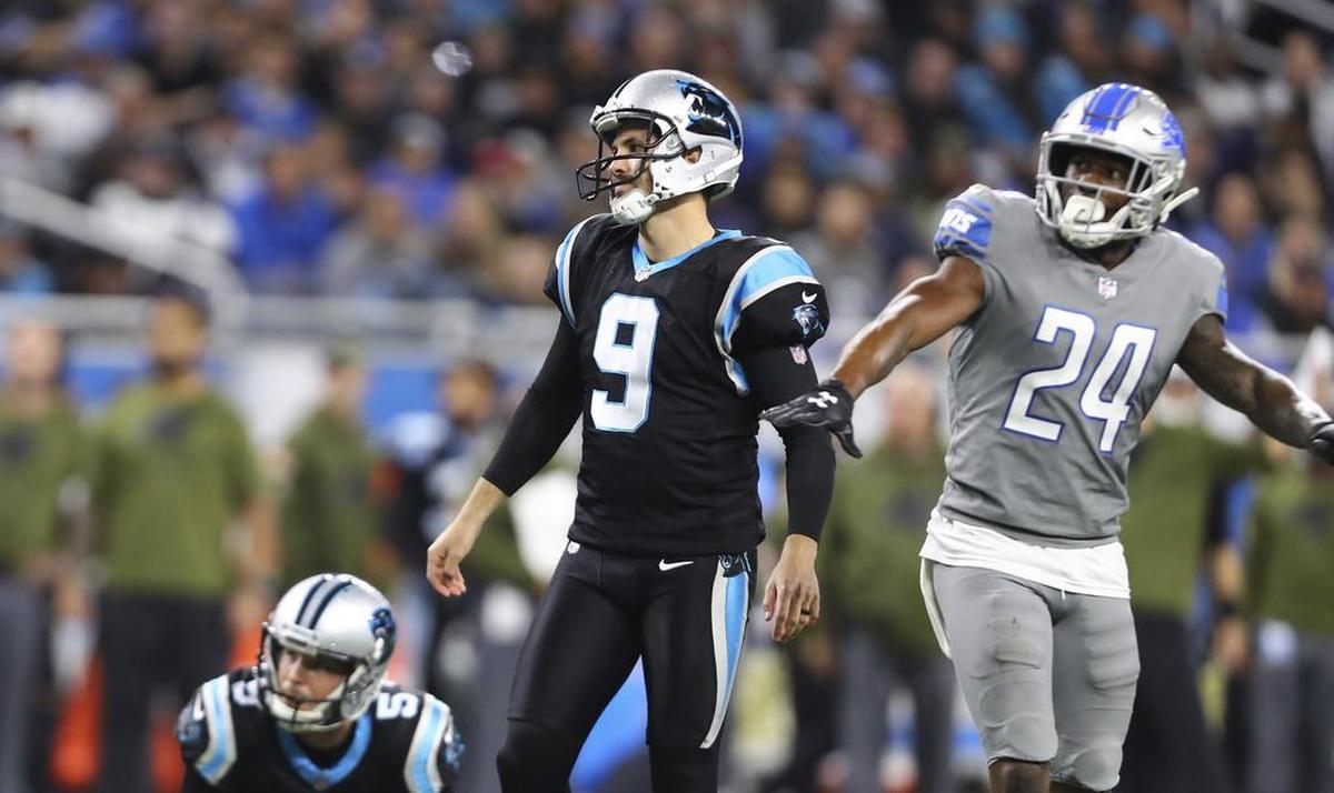 Detroit cornerback Nevin Lawson (24) waves his arms as Carolina kicker Graham Gano (9) watches his missed 34-yard field goal Sunday. Gano also missed an extra point in Carolina’s 20-19 loss.