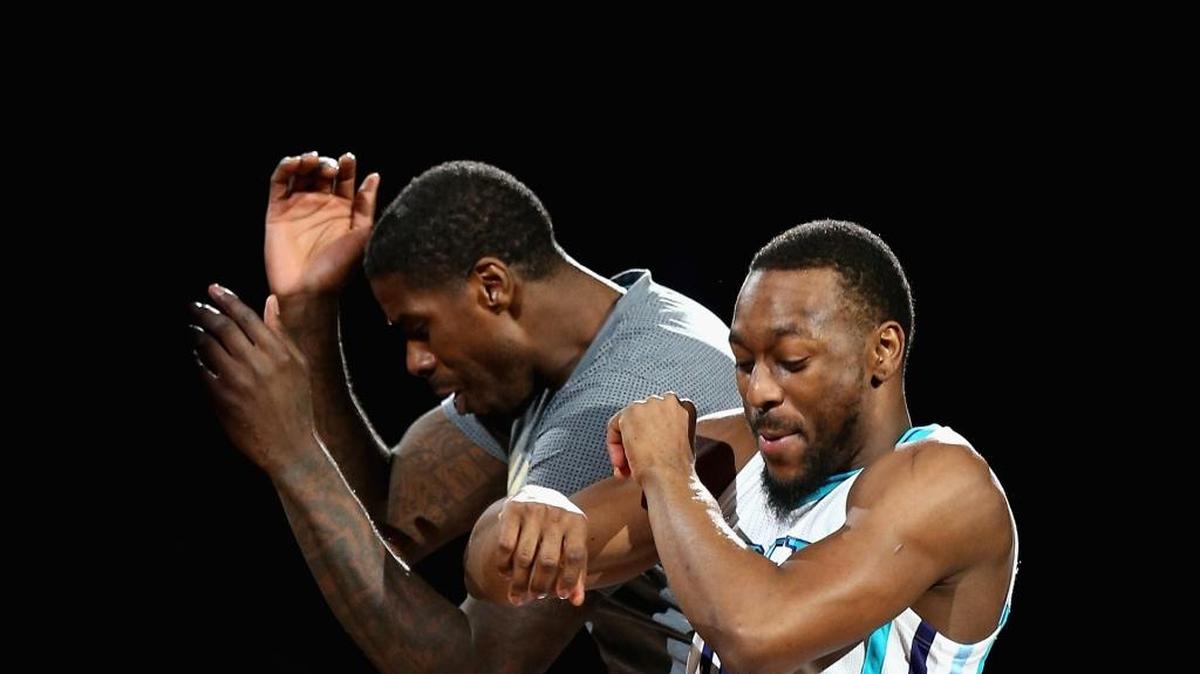 Hornets teammates Marvin Williams, left, and Kemba Walker celebrate during a recent game at Time Warner Cable Arena. The Hornets (37-29) are barely outside a top-five playoff seed entering Wednesday night’s home game against Orlando, but that’s a very realistic goal.