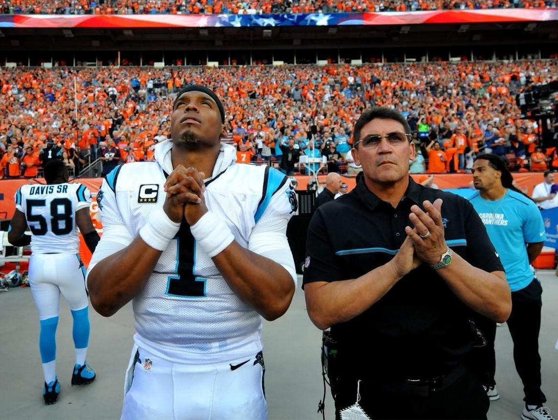 Cam Newton (left) and head coach Ron Rivera stand together before a game in Denver in 2016. Newton and Rivera both joined the Panthers in 2011 and left following the 2019 season.