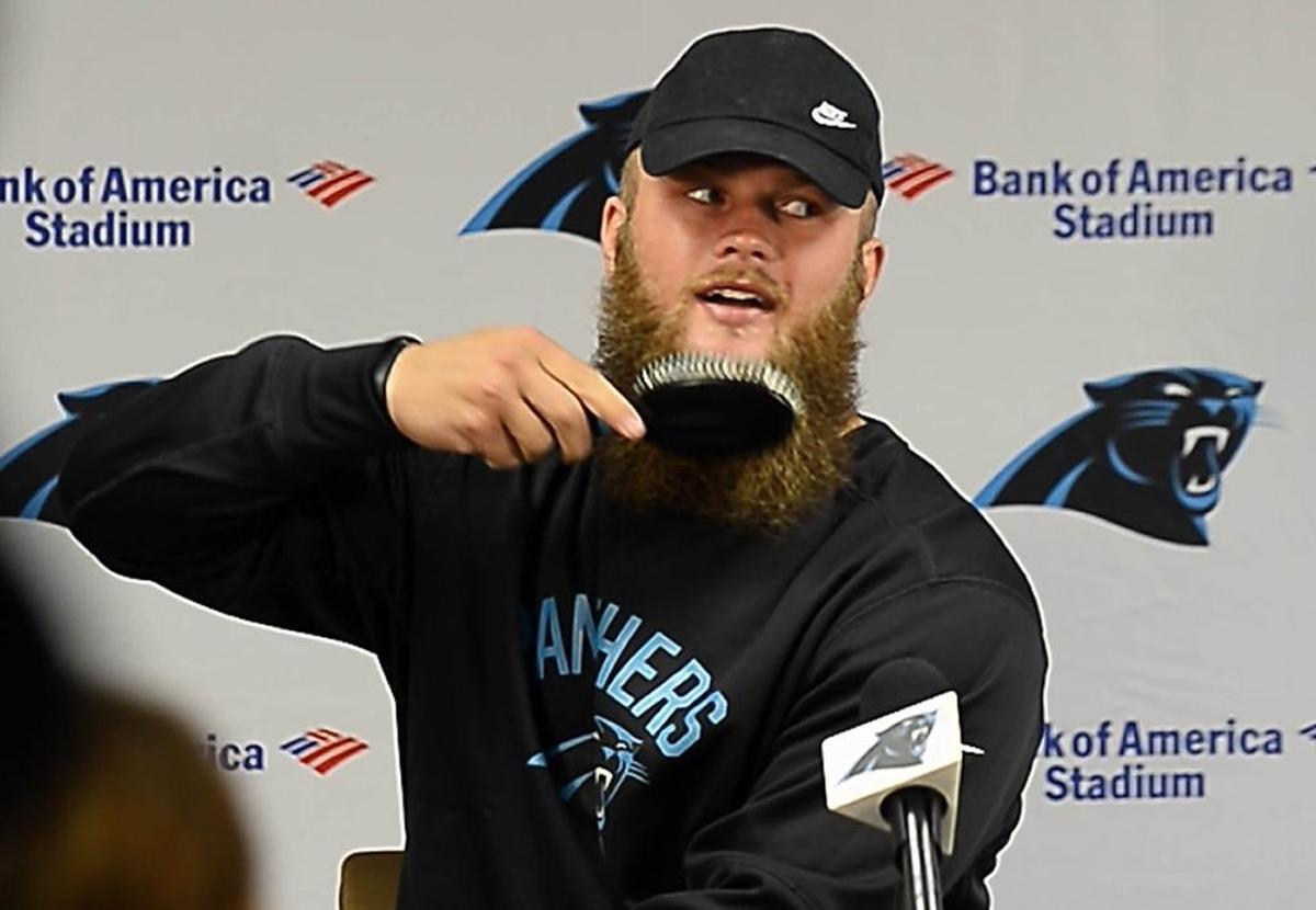 Carolina Panthers linebacker Ben Boulware brushes his beard at the start of a press conference during training camp in early August.