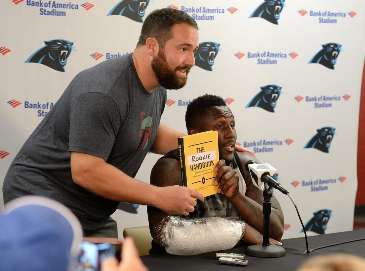 Carolina Panthers center Ryan Kalil, left, once broke into a press conference featuring teammate Thomas Davis in 2016 so he could pitch a book he co-wrote about the NFL.