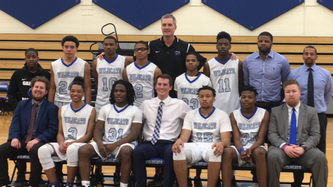 Christian Laettner (center back row, in black shirt) poses with the members of the Garinger high basketball team he helped coach this past week.