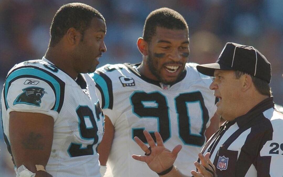 Carolina Panthers defensive ends Mike Rucker (93) and Julius Peppers (90) played together for six seasons, and Rucker still says he has a hard time believing Peppers’ athleticism.