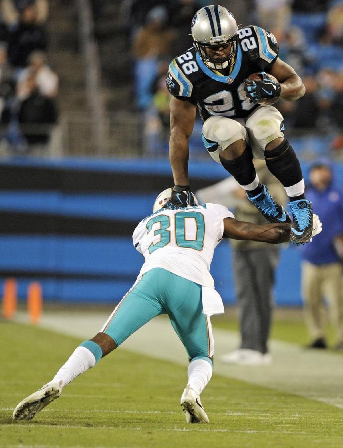 Carolina’s Jonathan Stewart (28) showed some hops Monday night as he rushed for a season high in yardage in the Panthers’ win over Miami.
