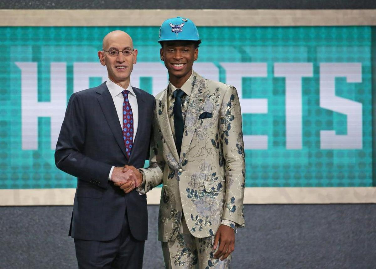 For a moment, it looked like Kentucky's Shai Gilgeous-Alexander, right, and his fashion-forward suit would be headed to Charlotte. That, too, would have been better than where the Hornets ended up.