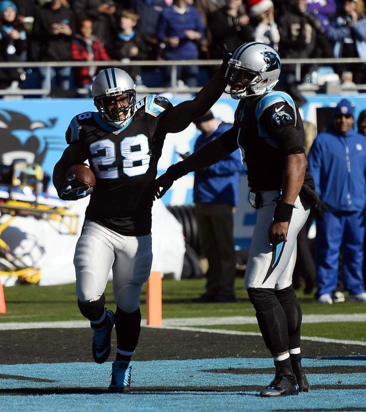Carolina Panthers running back Jonathan Stewart (28) celebrates his 60-yard touchdown run against Minnesota Sunday with quarterback Cam Newton. Stewart scored twice more on the day.