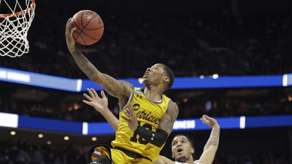 UMBC’s Jairus Lyles (10) believes he can get to the rim against anybody. He averages 20 points per game for his team, a No. 16 seed that takes on Kansas State Sunday night in Charlotte with the winner advancing to the Sweet 16.