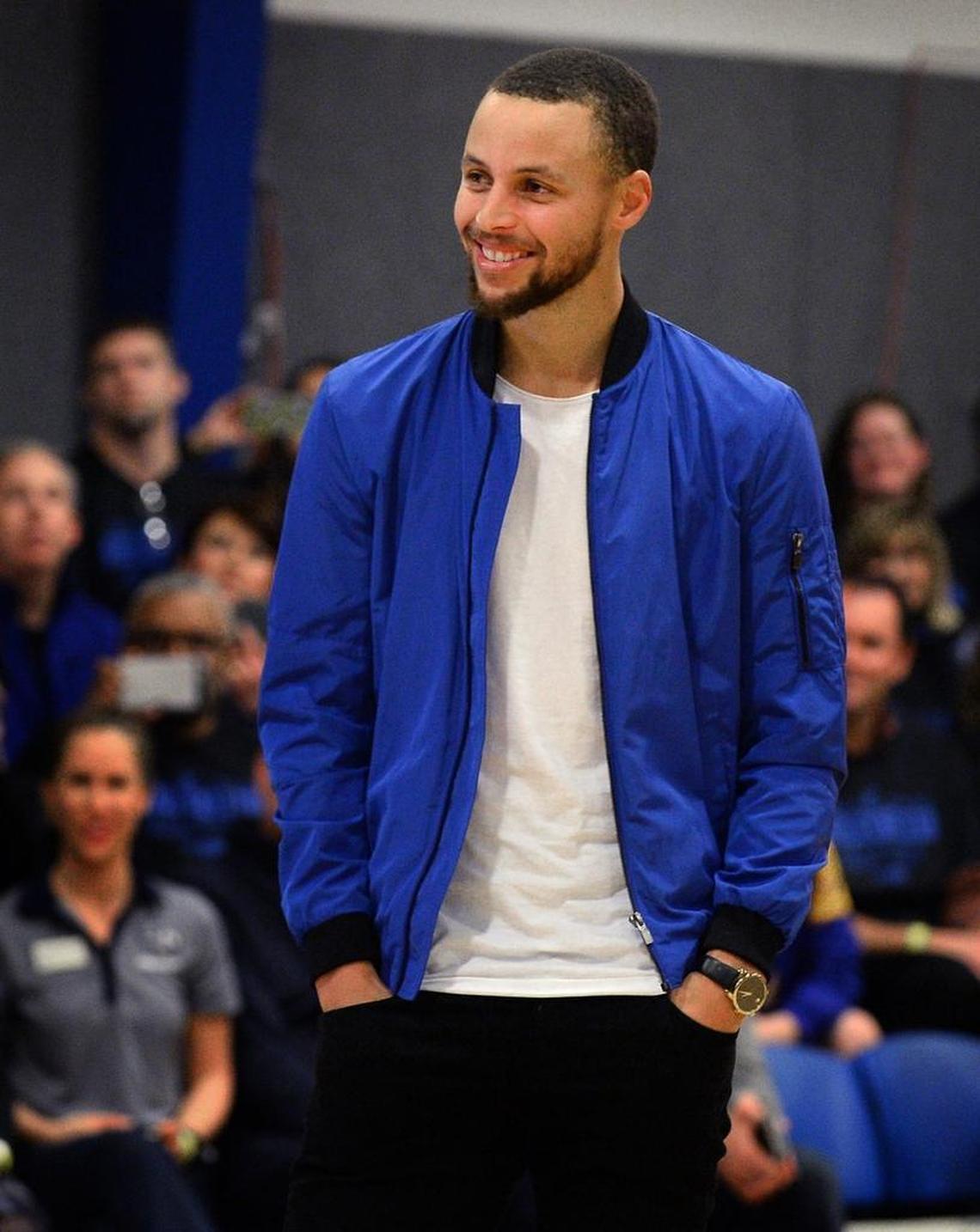 NBA star Steph Curry smiles in early 2017 at a ceremony at Charlotte Christian that was held to retire his high school jersey.