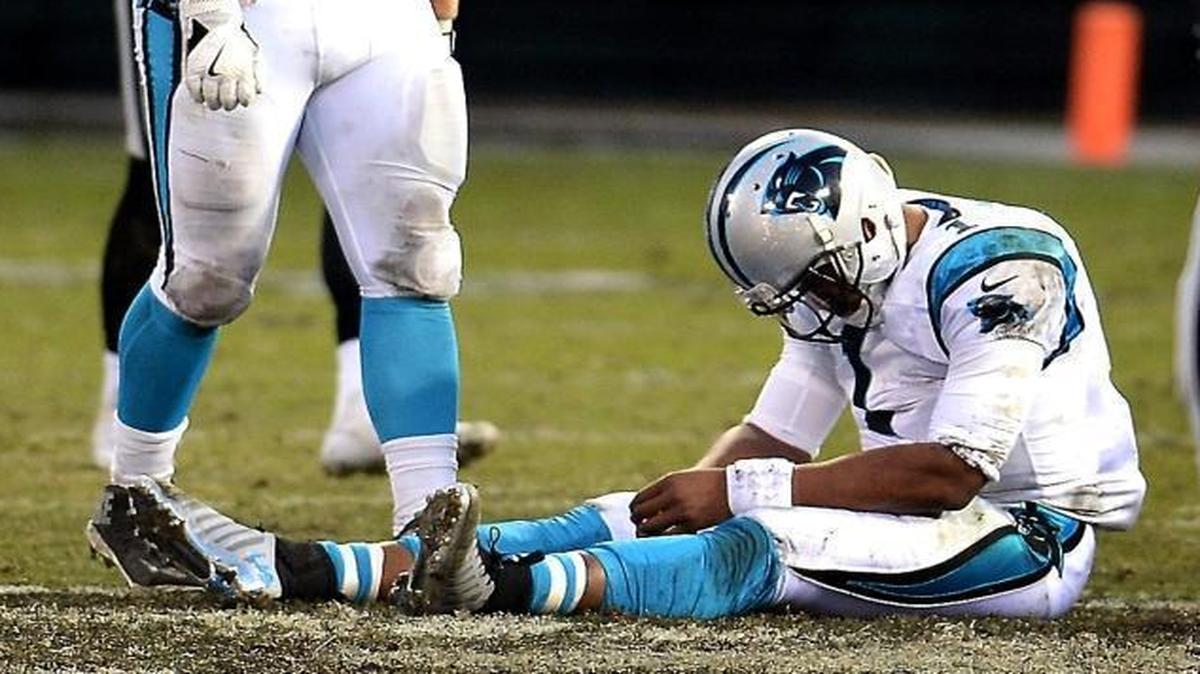Carolina Panthers quarterback Cam Newton sits on the turf dejected after having the ball stripped from his hand by Oakland Raiders defensive end Khalil Mack during late fourth-quarter action on Sunday. Mack recovered the ball to seal the Raiders victory, 35-32.