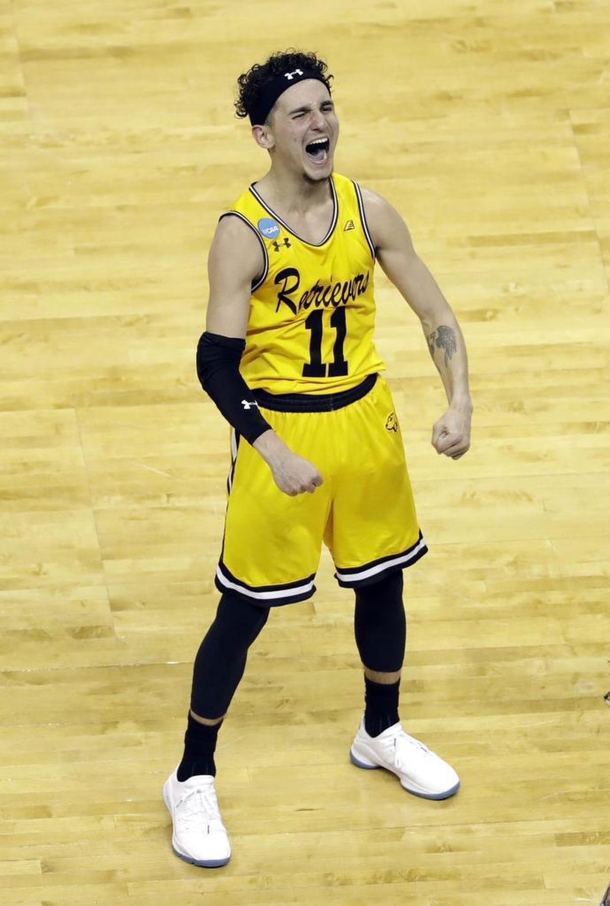 UMBC point guard K.J. Maura – who is 5-foot-8 and 140 pounds – celebrates his team’s 74-54 win over Virginia Friday. It was the first time in 136 games that a No. 16 seed had beaten a No. 1 seed in the NCAA tournament’s first round.