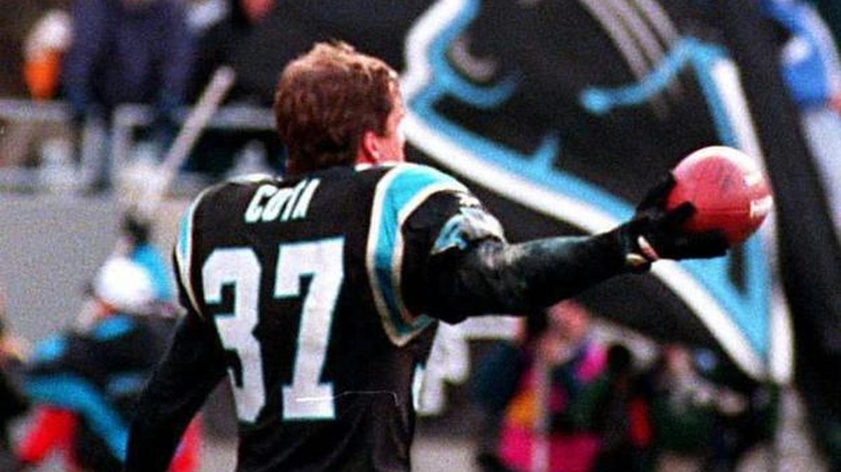 Panthers safety Chad Cota shows the ball to a jubilant Charlotte crowd after preserving Carolina’s 18-14 win over Pittsburgh with an interception on the final day of the 1996 regular season. Cota’s interception gave Carolina its only win ever over the Steelers.