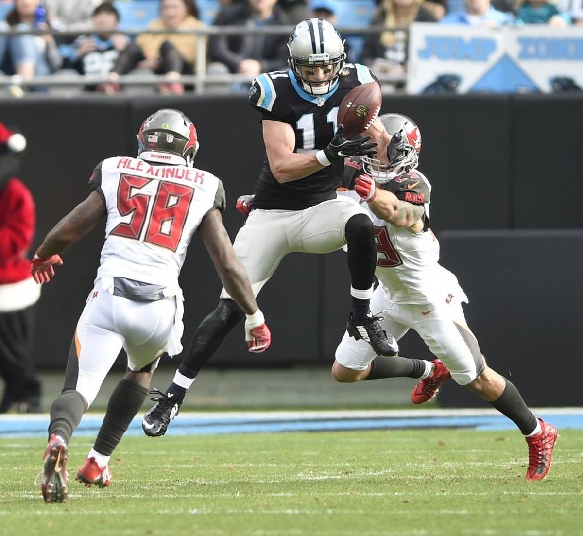 Carolina wide receiver Brenton Bersin (11) dropped this third-down pass, allowing Tampa Bay’s Kwon Alexander (58) to intercept the ball.
