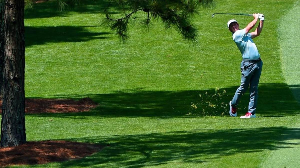 Rory McIlroy follows through on his second shot from the seventh fairway during second round action of The Masters on Friday. His 71 was one of the best scores of the day.