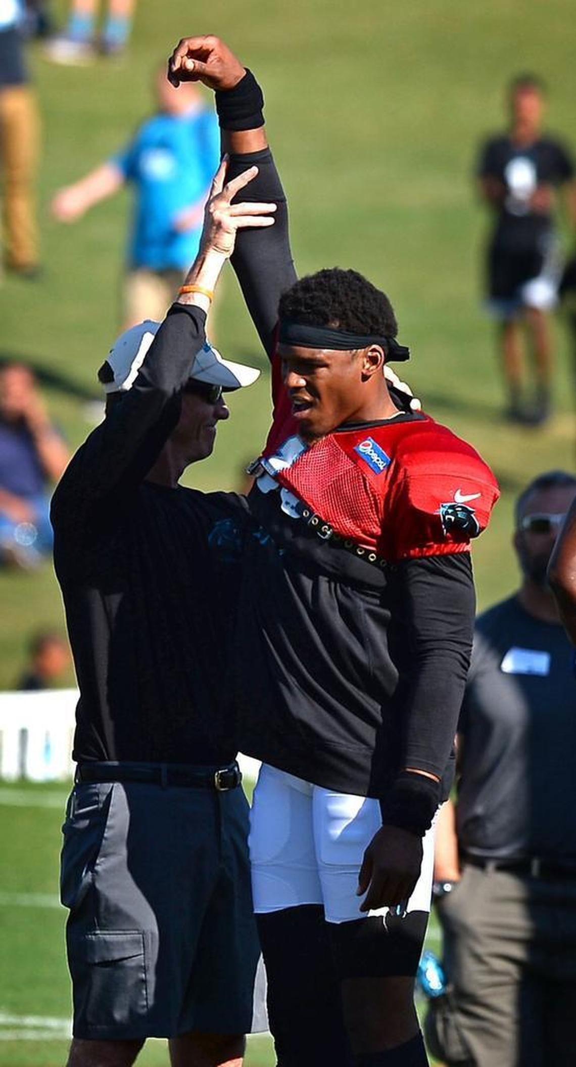 Carolina Panthers head athletic trainer Ryan Vermillion works with quarterback Cam Newton (1) on his throwing arm/shoulder area on Tuesday, at Wofford College.