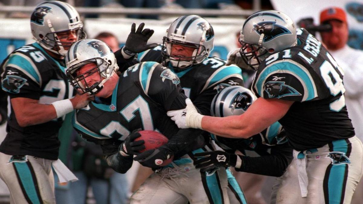 
Chad Cota (37) -- being mobbed by teammates -- had the game-winning interception against Pittsburgh in 1996 that clinched the Panthers’ first-ever division championship and playoff berth. That game, won 18-14 by Carolina, was among those fans voted for as the most memorable sporting event they have ever seen in Charlotte.
