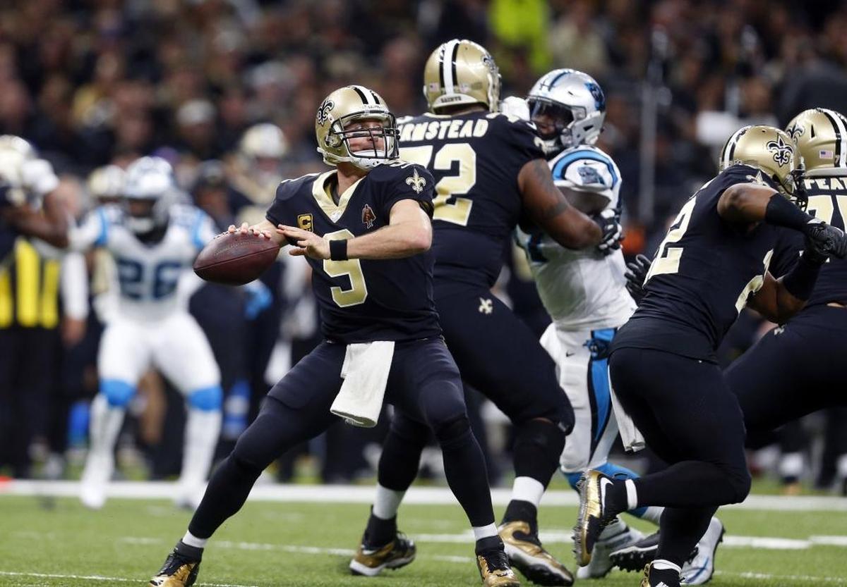 New Orleans Saints quarterback Drew Brees (9) throws during the first half Sunday against Carolina. By halftime, Brees had already thrown for 230 yards and two touchdowns.